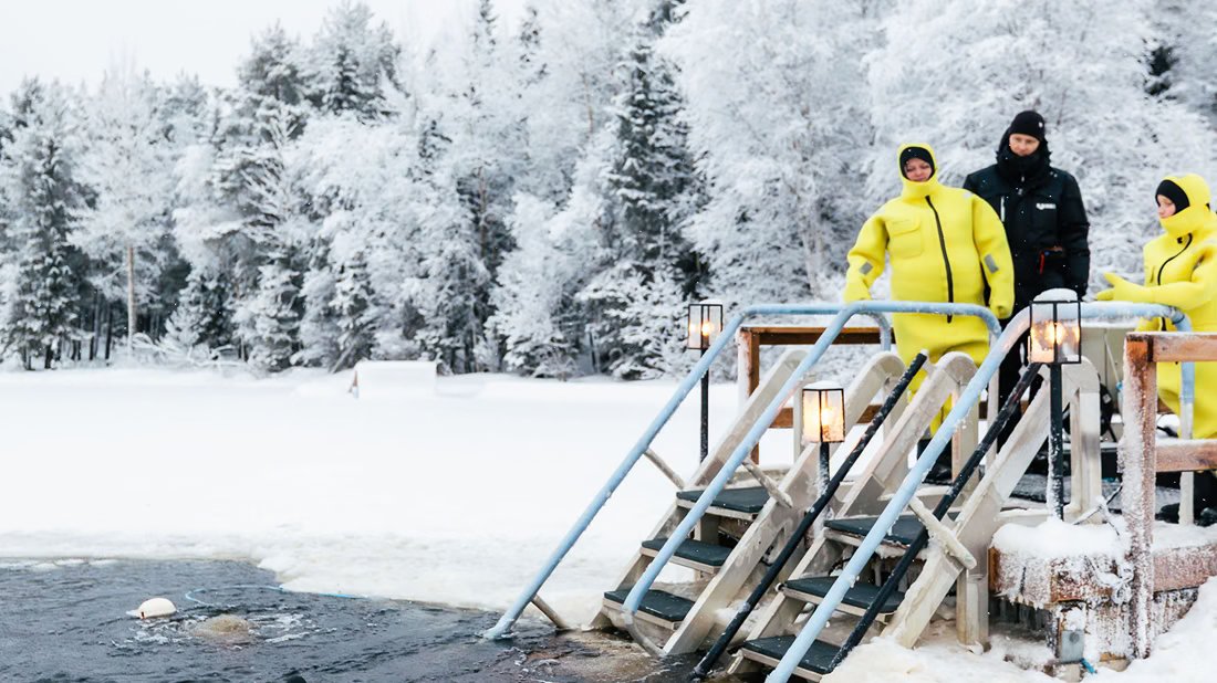 Guests on the pier by the frozen lake